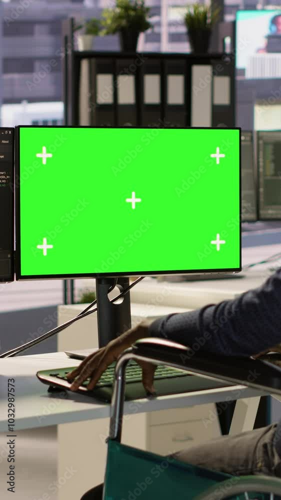 Poster vertical video person with disability testing and deploying programs and systems on green screen pc.