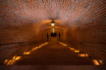 Stairs down to the giant wine cellar.
Tunnel. Bricks.