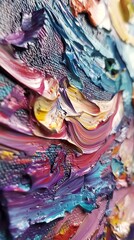 A close-up of a vibrant abstract painting with thick layers of oil paint in shades of pink, purple,...