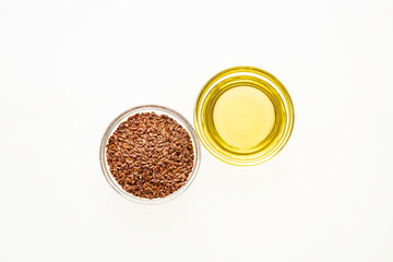 Flaxseed oil in bowl - Healthy Linum usitatissimum seeds.