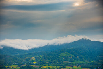 Beautiful Mountain landscape foggy windy mountain range green landscape asian farm. Amazing Landscape mountain green field meadow white cloud blue sky on sunrise. Countryside sunlight heaven scenery
