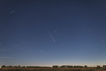 A comet in the fall sky at dusk