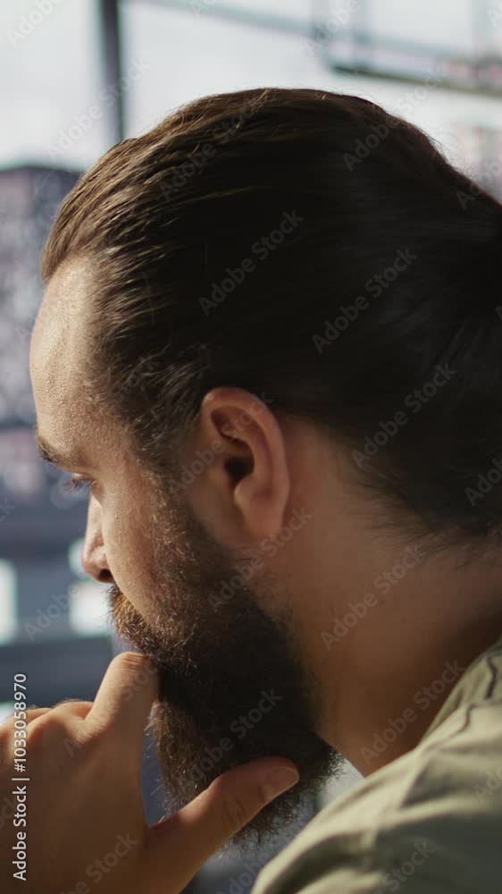 Poster vertical video pensive employee using computer to analyze datasets, focused on comparing datasets an
