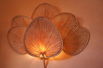 Elegant LeafInspired Rattan Wall Light Fixture for a sophisticated and stylish ambiance