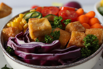Fried tofu salad in a bowl close-up