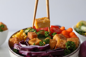 Fried tofu salad in a bowl close-up