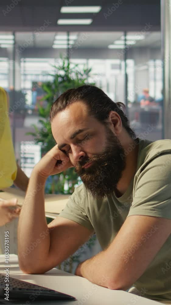 Poster vertical video exhausted developer caught asleep at desk by manager while developing ai machine lear