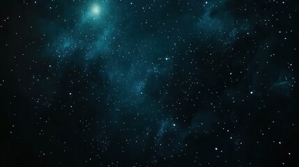 Obraz premium A deep blue starry night sky with a bright nebula in the upper left corner.