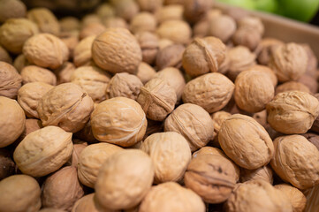 Pile of walnuts in market, product rich in minerals and vitamins