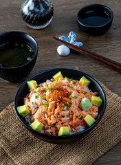 Salmon don rice. ingredient : fish meat , salmon belly , avocado