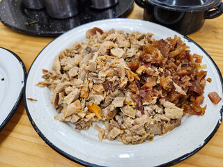 Plate of piglet carnitas, ready to eat in a restaurant, Mexican food in Guadalajara