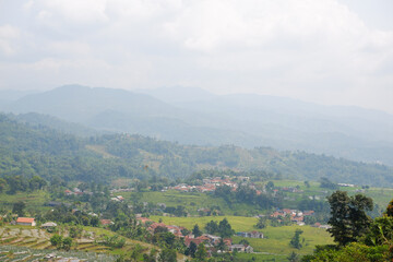 Beautiful view of green hills and mountains with lots of fog around