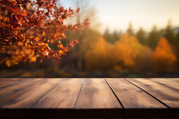 The empty wooden table top with blur background of autumn
