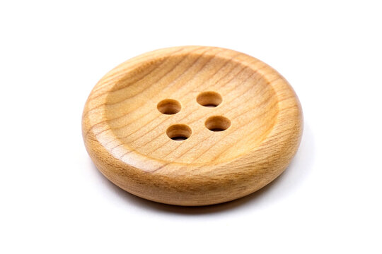 Round wooden button on white background