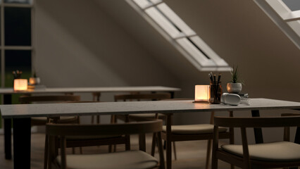 A close-up of a table with armchairs in a contemporary co-working space at night.