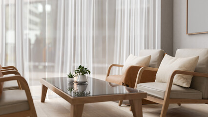 A comfortable Scandinavian living room featuring wooden armchairs with pillows and a coffee table.