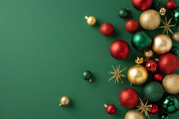 A collection of colorful Christmas ornaments and golden stars elegantly arranged on a deep green background, evoking the festive spirit of the holiday season