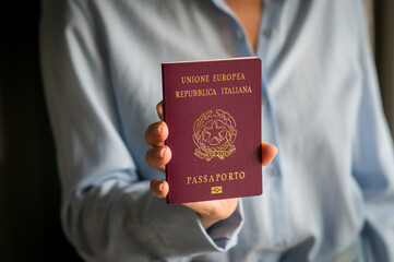 Woman holding Italian passport ready for international travel