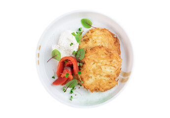 Russian and Belarus draniki or potato pancakes wish sour cream and smoked salmon