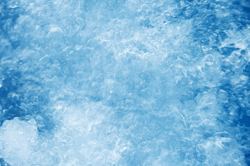 Bubbling water texture, flow thermal water as abstract background macro photo, spa and wellness theme, gentle ripples and gurgling on white blue aquatic surface, sea color gradient