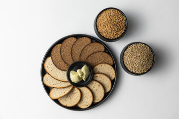 Artisan Bread Slices with Grains and Herb Butter