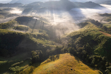 Landscape of Morning Mist with Mountain Layer at north of Thailand. mountain ridge and clouds in...