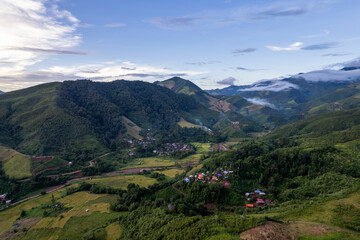 Obraz premium Landscape of Morning Mist with Mountain Layer at north of Thailand. mountain ridge and clouds in rural jungle bush forest