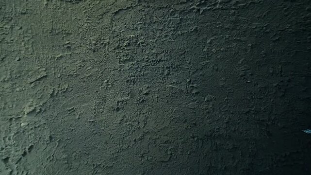 Black dark concrete wall video. Board cement texture grunge dirty scratched for show anthracite promote product urban floor. close up. 4K
