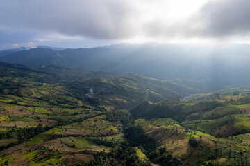 Obraz premium Landscape of Morning Mist with Mountain Layer at north of Thailand. mountain ridge and clouds in rural jungle bush forest