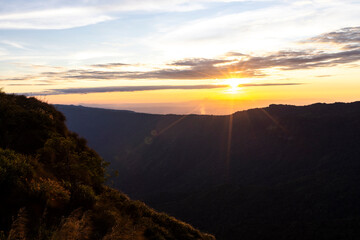 Landscape of Morning Mist with Mountain Layer at north of Thailand. mountain ridge and clouds in rural jungle bush forest
