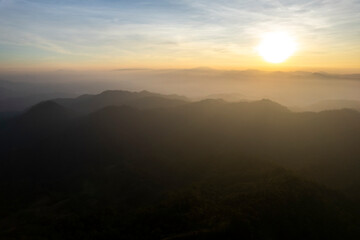 Landscape of Morning Mist with Mountain Layer at north of chiang rai Thailand. mountain ridge and clouds in rural jungle bush forest