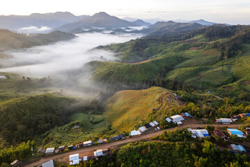 Landscape of Morning Mist with Mountain Layer at north of Thailand. mountain ridge and clouds in...