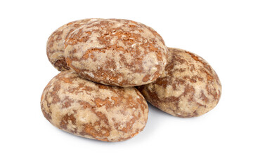 A pile of round sweet gingerbread on a white background. Brown gingerbread with icing.