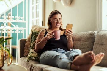 Coffee, smile and woman on sofa, smartphone and internet with social media, texting and connection....