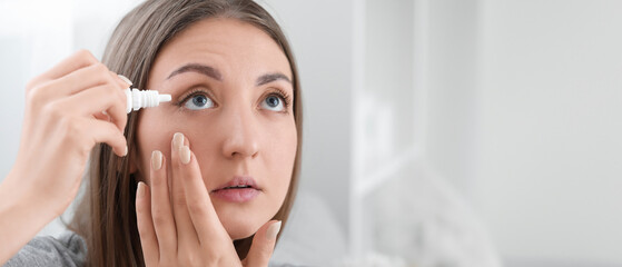 Beautiful woman using eye drops at home, closeup