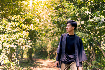 Man Enjoys the Stillness of Nature's Beauty. Misty Morning in the Mountain Woods: A Scenic View of Nature.