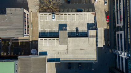 Aerial view of small parking lot between buildings