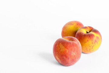 Sweet peaches on white background