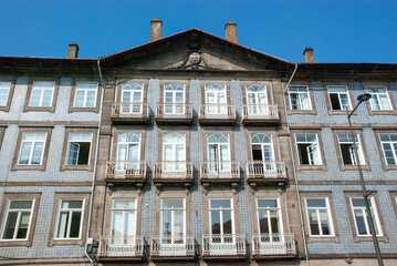 Facade of typical Portuguese house in Porto with blue azulejo tiles - Portugal 