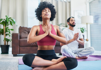 Obraz premium Namaste, yoga and woman in home for meditation, mindfulness exercise and prayer hands. Relax, interracial couple and breathing for peace, calm or spiritual wellness for body health, zen and fitness