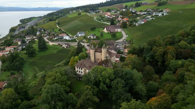 Push in establishing drone shot of Vaumarcus Castle in Canton of Neuchatel Switzerland