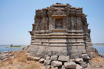Carved idols on the outer wall of an old temple, near Palasdev Temple, Ujani Dam, Maharashtra, India
