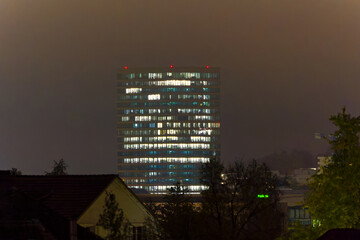 Skyline of north part of Swiss City of Zürich with office tower skyscraper on an autumn night with colorful night sky background. Photo taken October 16th, 2024, Zurich, Switzerland.