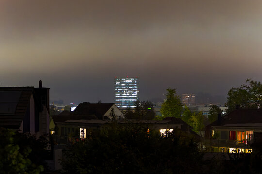 Skyline of north part of Swiss City of Zürich with office tower skyscraper on an autumn night with colorful night sky background. Photo taken October 16th, 2024, Zurich, Switzerland.