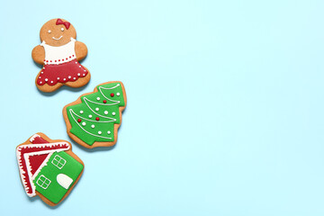 Tasty Christmas cookies on blue background