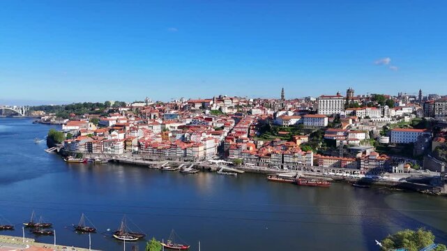 Porto, Portugal. Aerial view of the old city with promenade of the Douro river and old bridge.