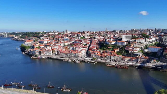 Porto, Portugal. Aerial view of the old city with promenade of the Douro river and old bridge.