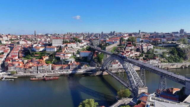 Porto, Portugal. Aerial view of the old city with promenade of the Douro river and old bridge.