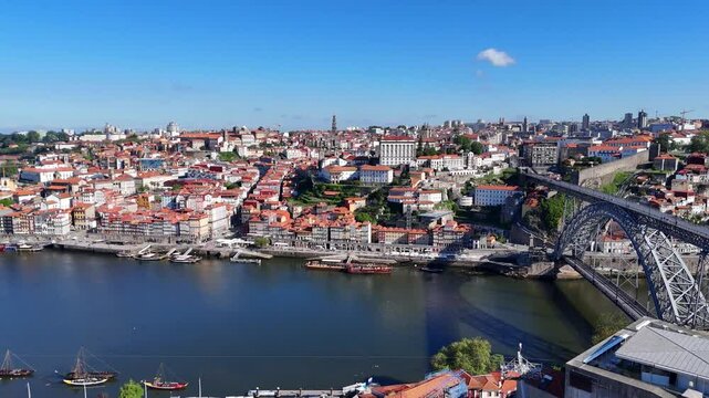 Porto, Portugal. Aerial view of the old city with promenade of the Douro river and old bridge.