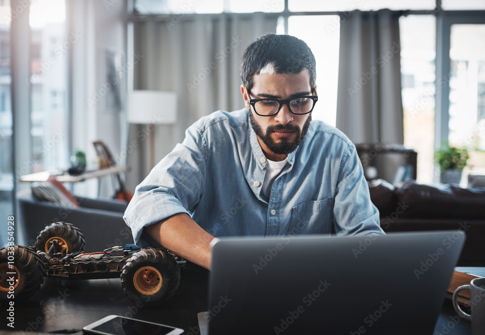 Aufkleber Laptop, robotics and typing with engineer man in home office for invention or remote work. Car, model and proposal with person busy on computer in apartment for problem solving or vehicle design